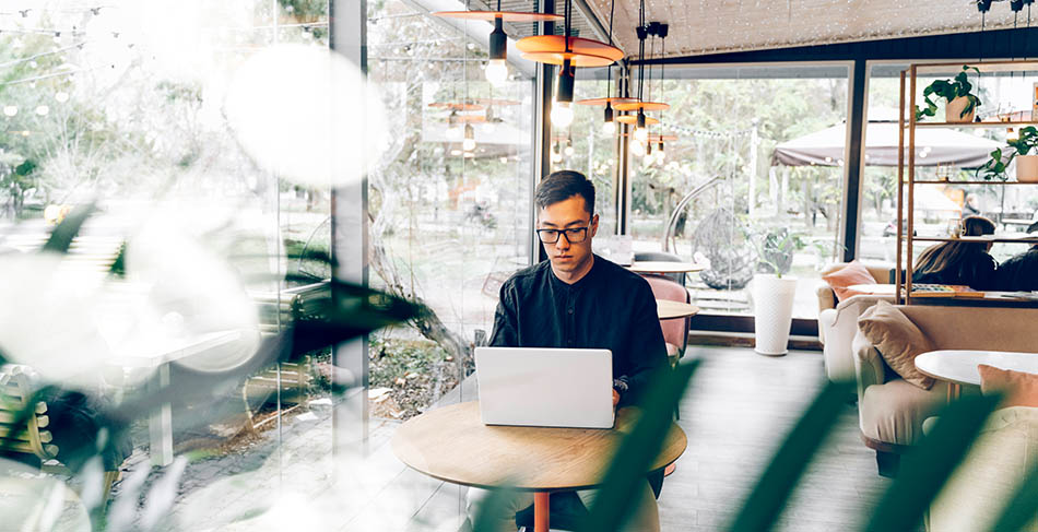Man working in café